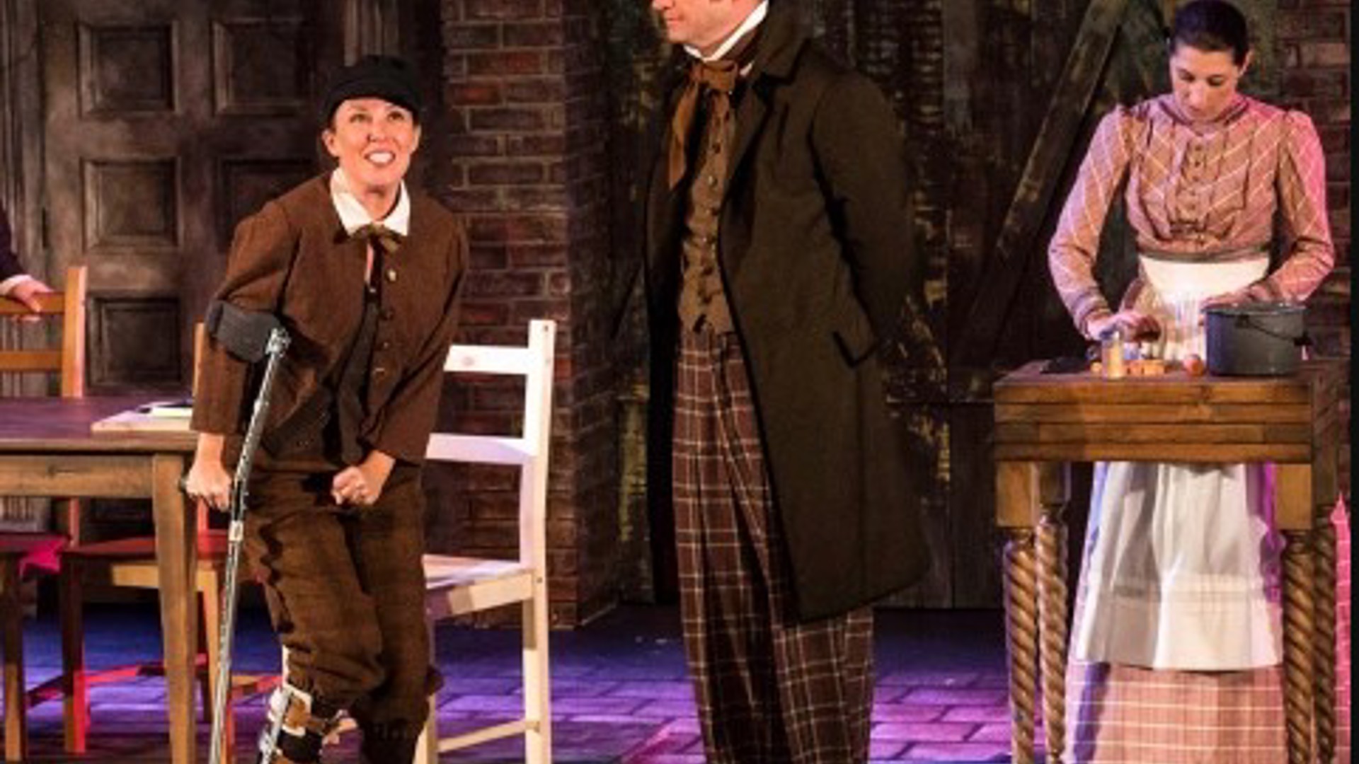 The Second City assemble in a play production photo for A Christmas Carol