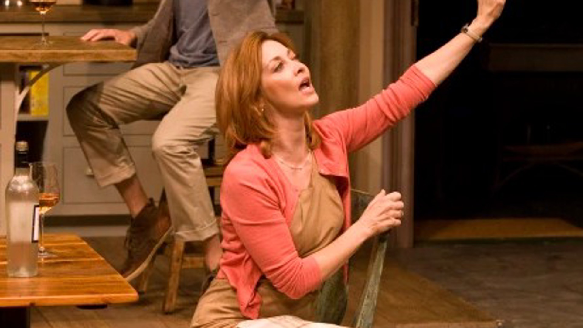 Johanna Day sitting on set in the play Poor Behavior