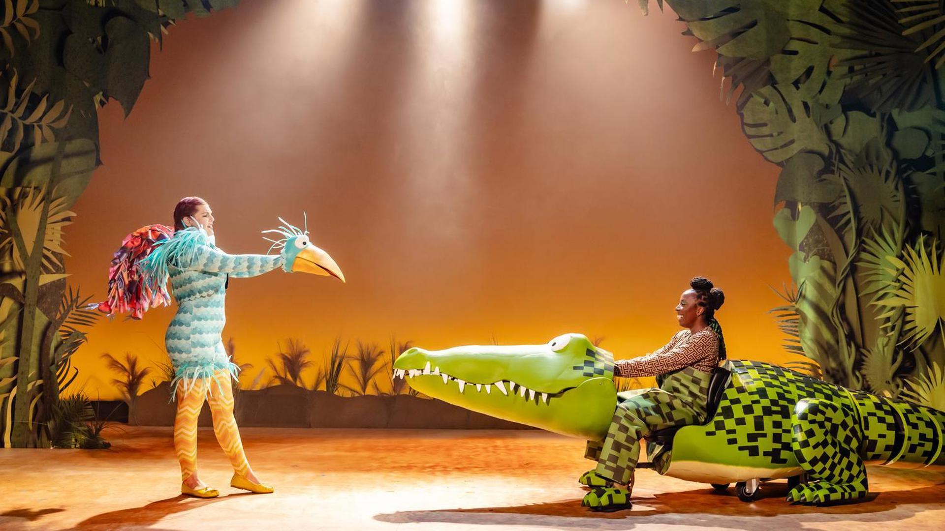 A large blue bird talks to The Enormous Crocodile.