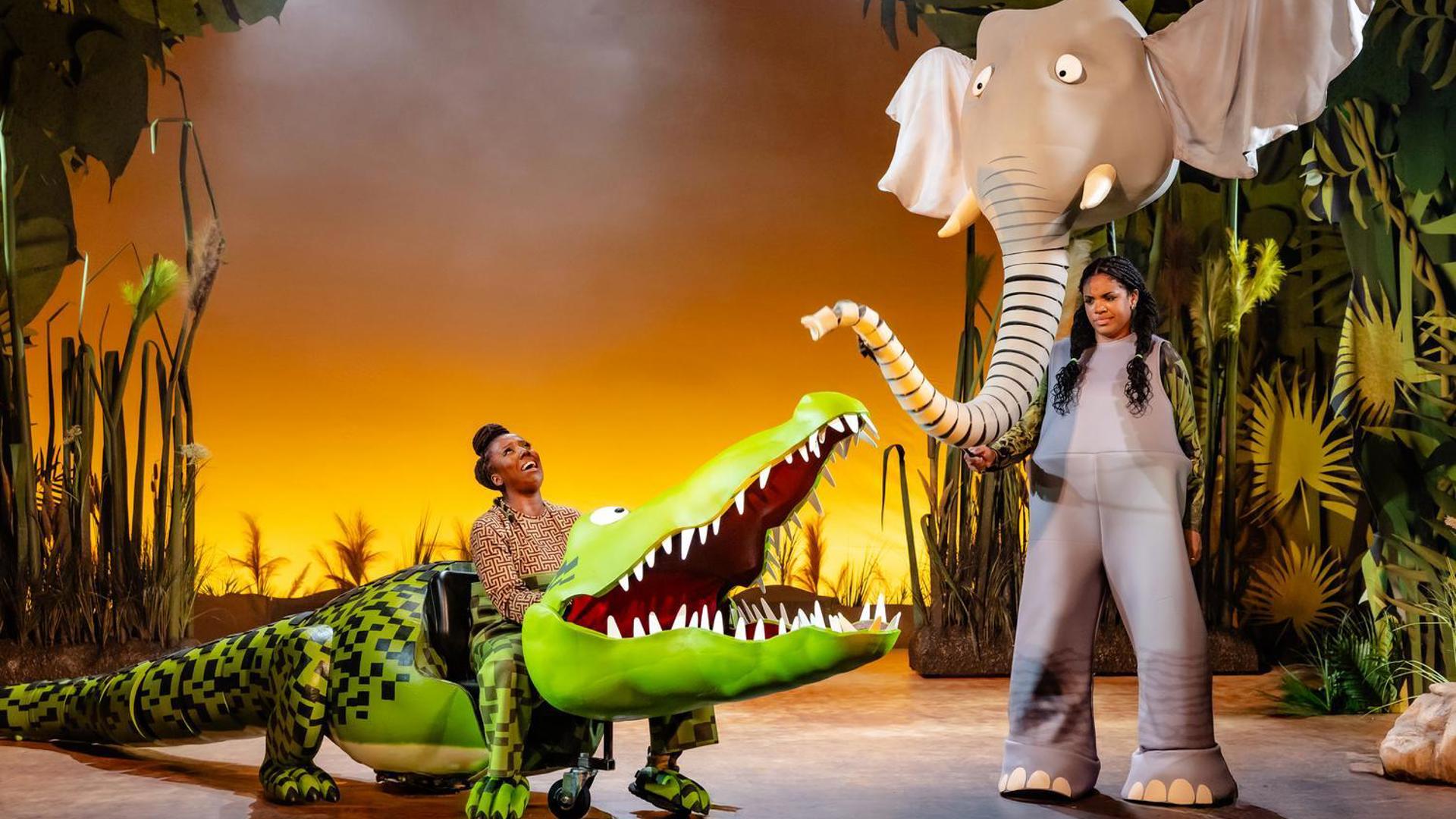 The Enormous Crocodile laughs while talking with an elephant.