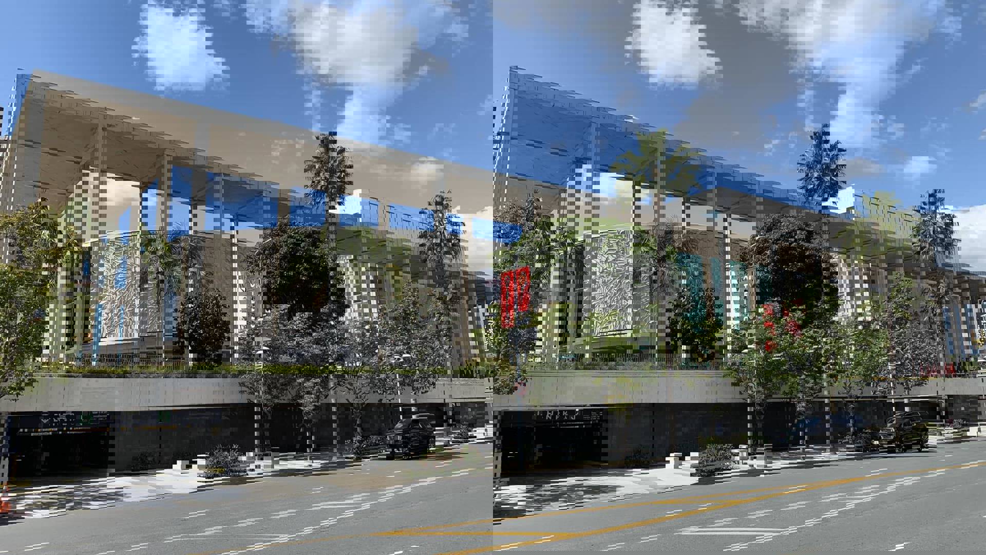 Exterior images of the Mark Taper Forum and the Ahmanson Theatre on a blue partially cloudy day. 