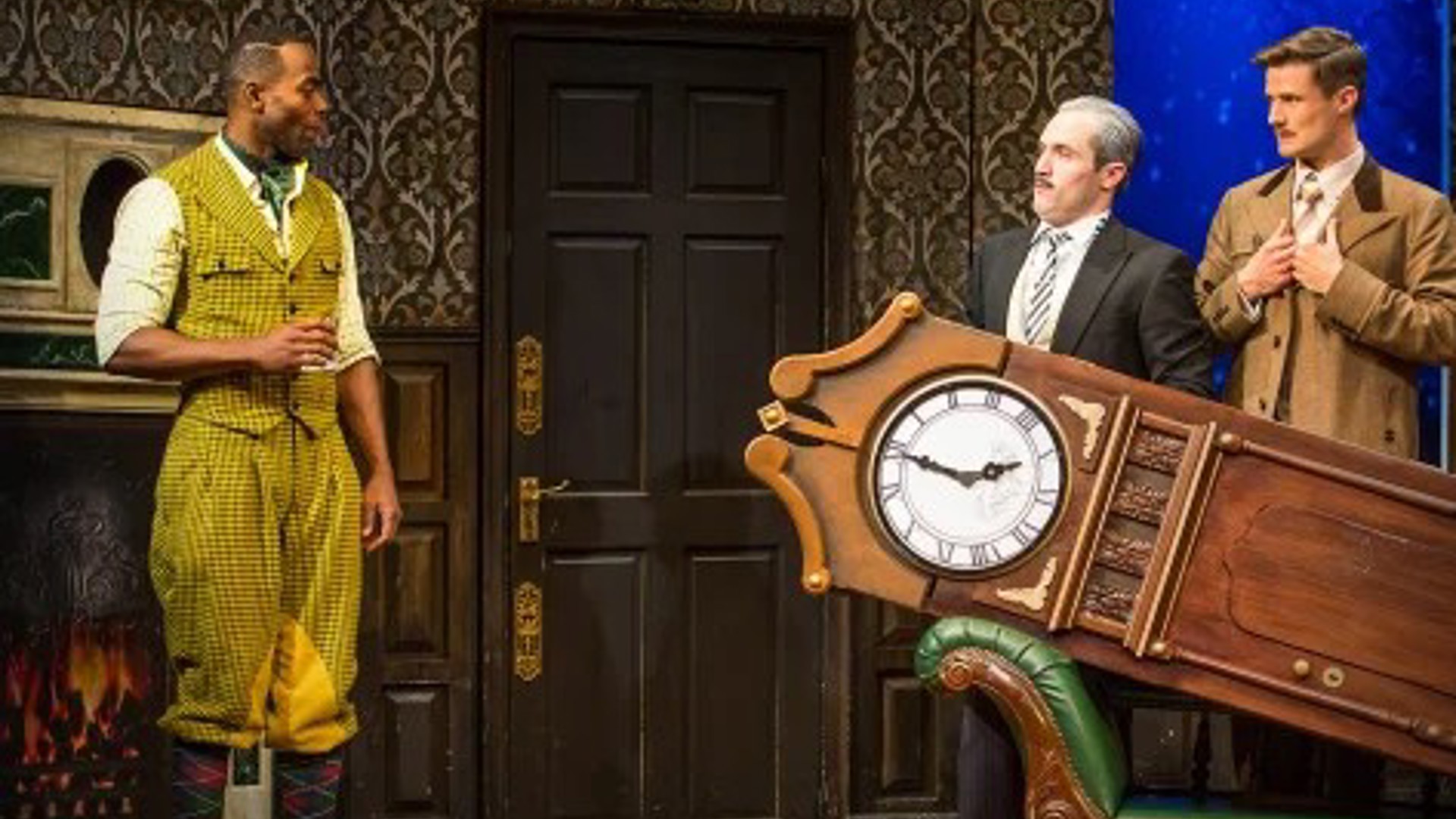 The Play That Goes Wrong cast in costume on stage at Ahmanson Theatre