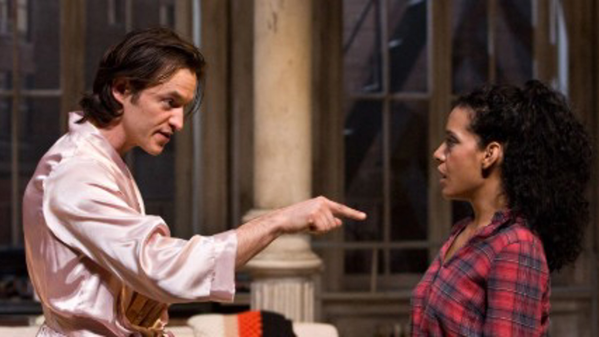 Adam Rothenberg and Zabryna Guevara performing on stage in a production of Burn This