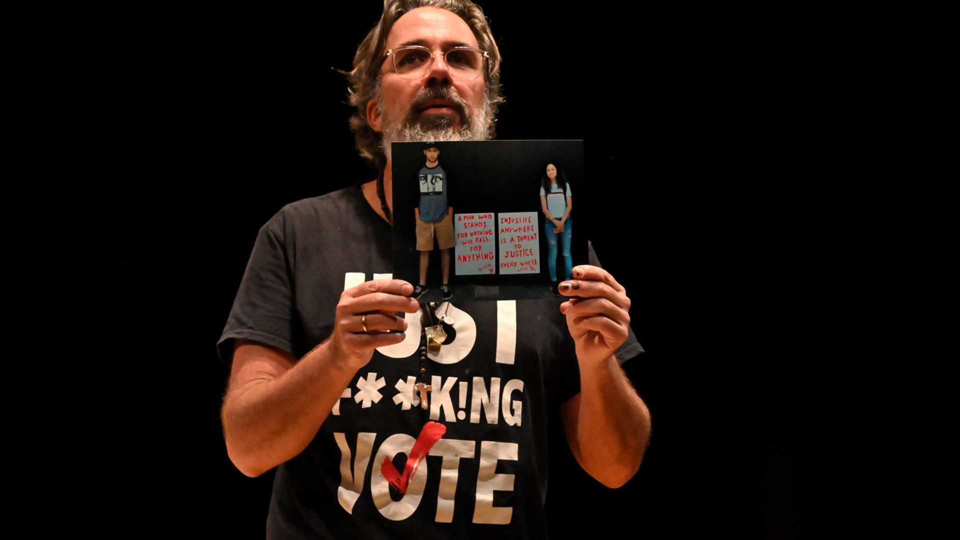 Manuel Oliver in GUAC holds a photo.