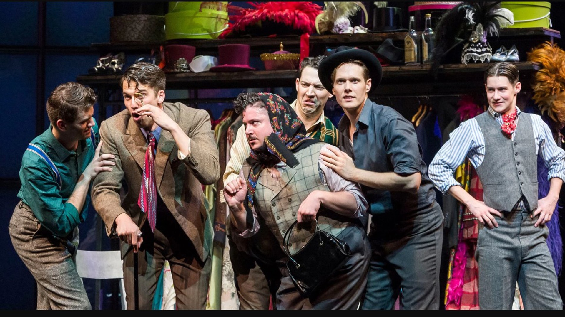 the cast of a new musical Harmony in costume on stage performing