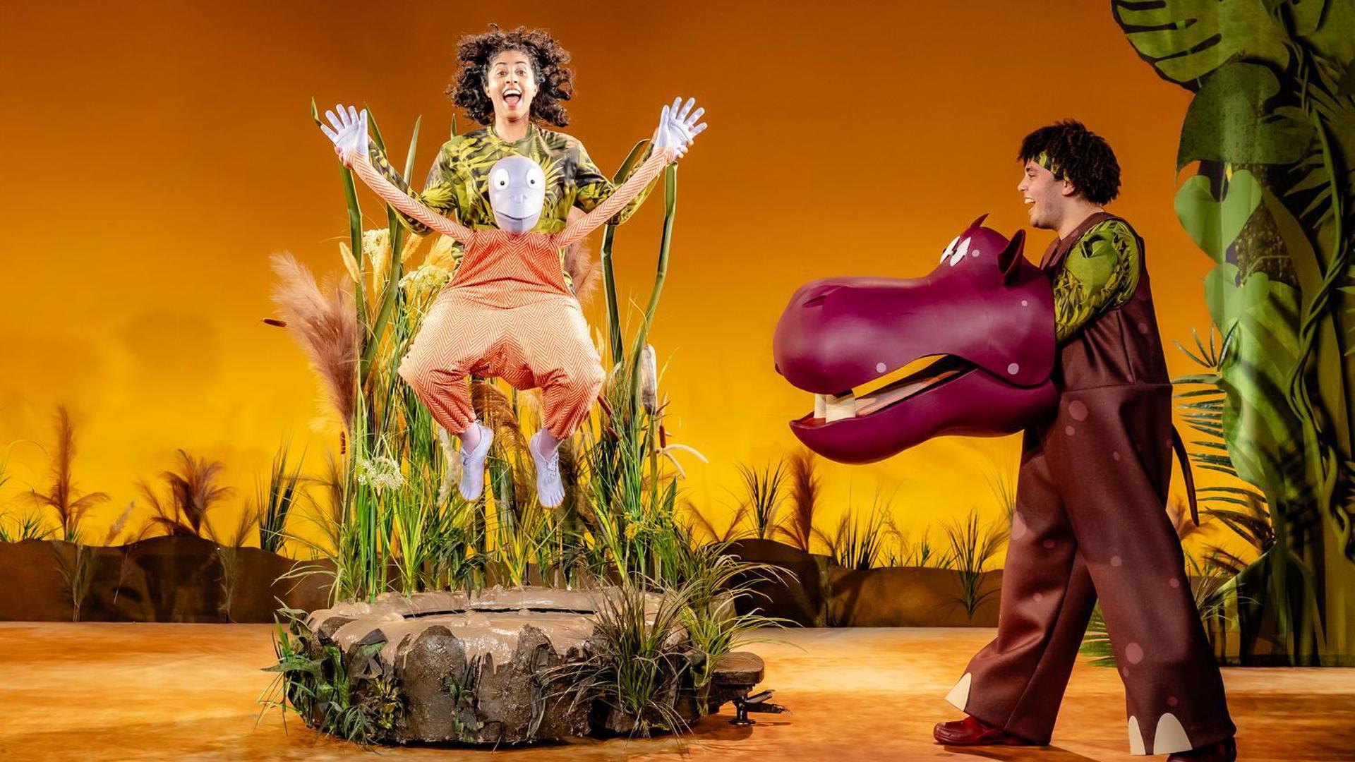 A jumping orangutan and a smiling hippo.