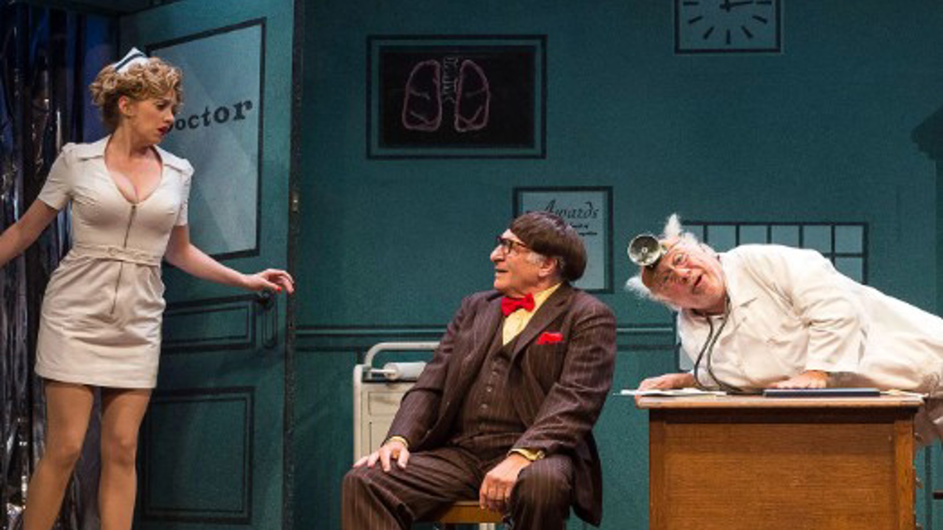 a nurse a doctor and man in a suit in an office acting