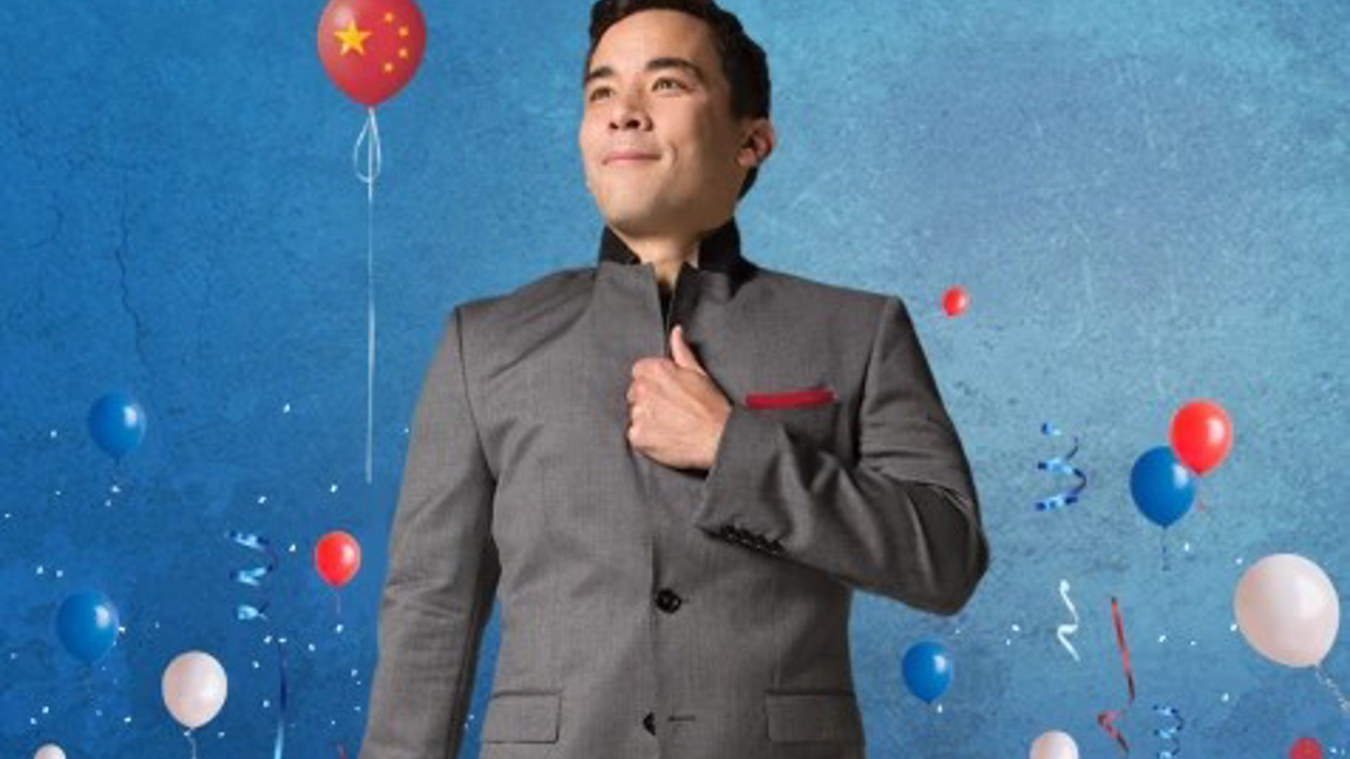 Billy Bustamante in a military like uniform with balloons staged in celebration