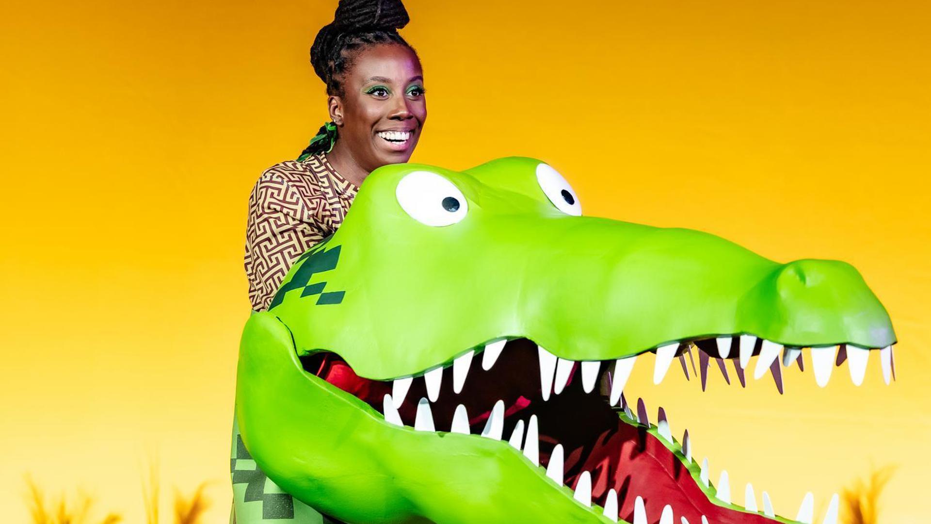 The Enormous Crocodile smiles with his jaw open.
