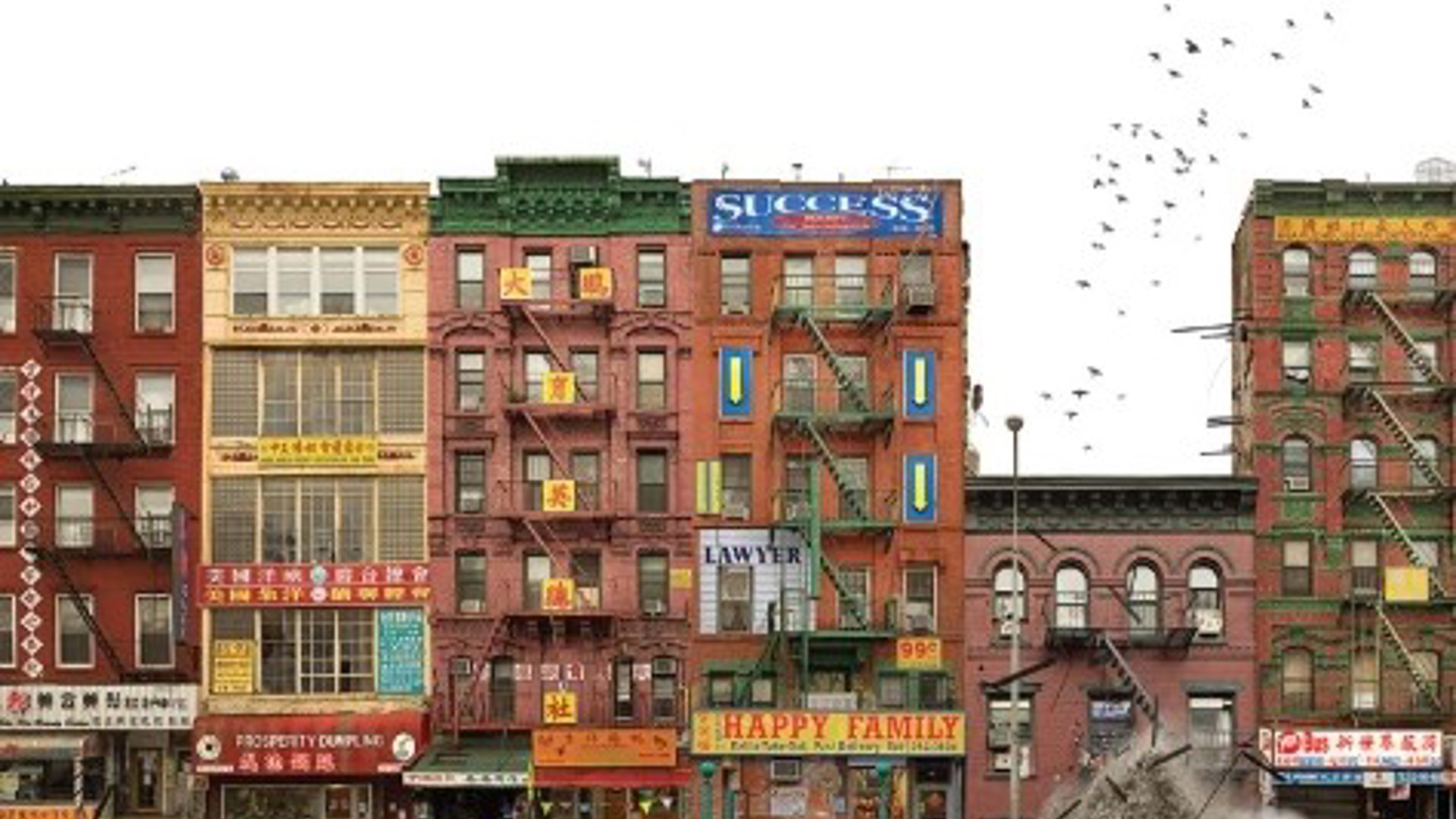 older lower Manhattan apartment buildings with storefront shops