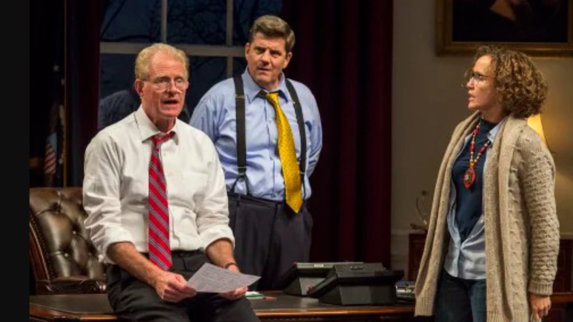 two men and a woman in the white house oval office