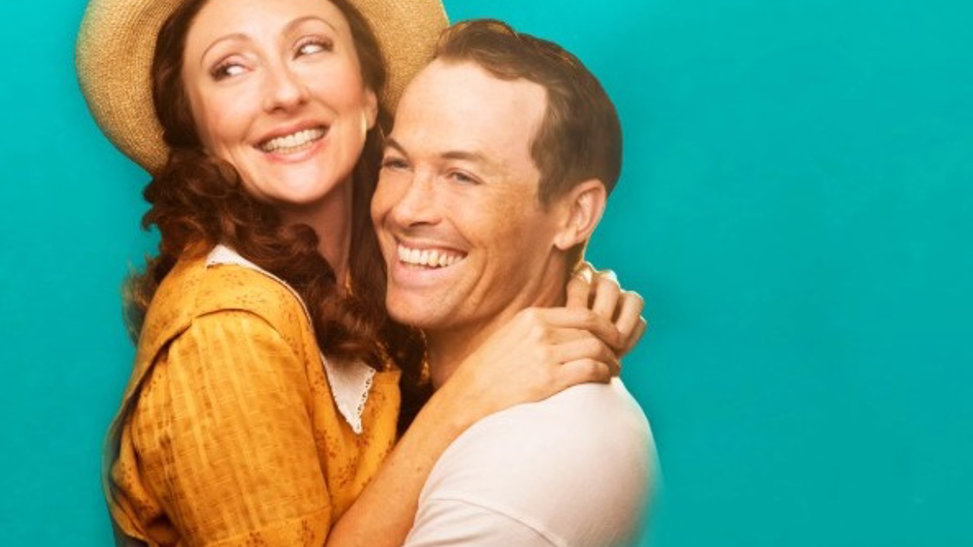Carmen Cusack and Stephen Lee Anderson in costume hugging