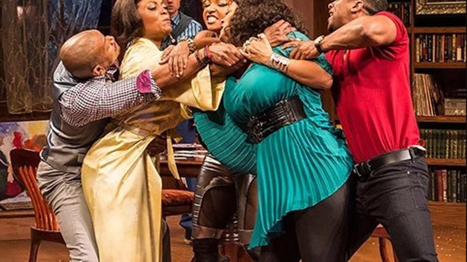 The Bryant family reunion cast acting in a comedic family dispute scene on stage