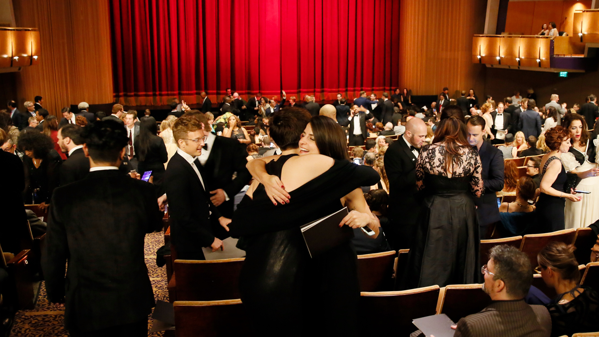 An active audience in the Ahmanson Theatre before a performance.