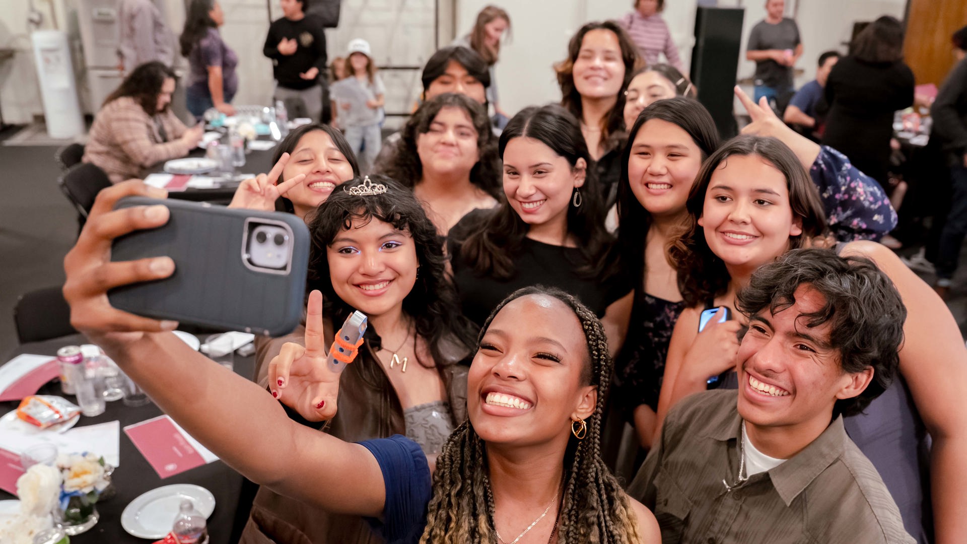 A group of student ambasadors take a group selfie. 