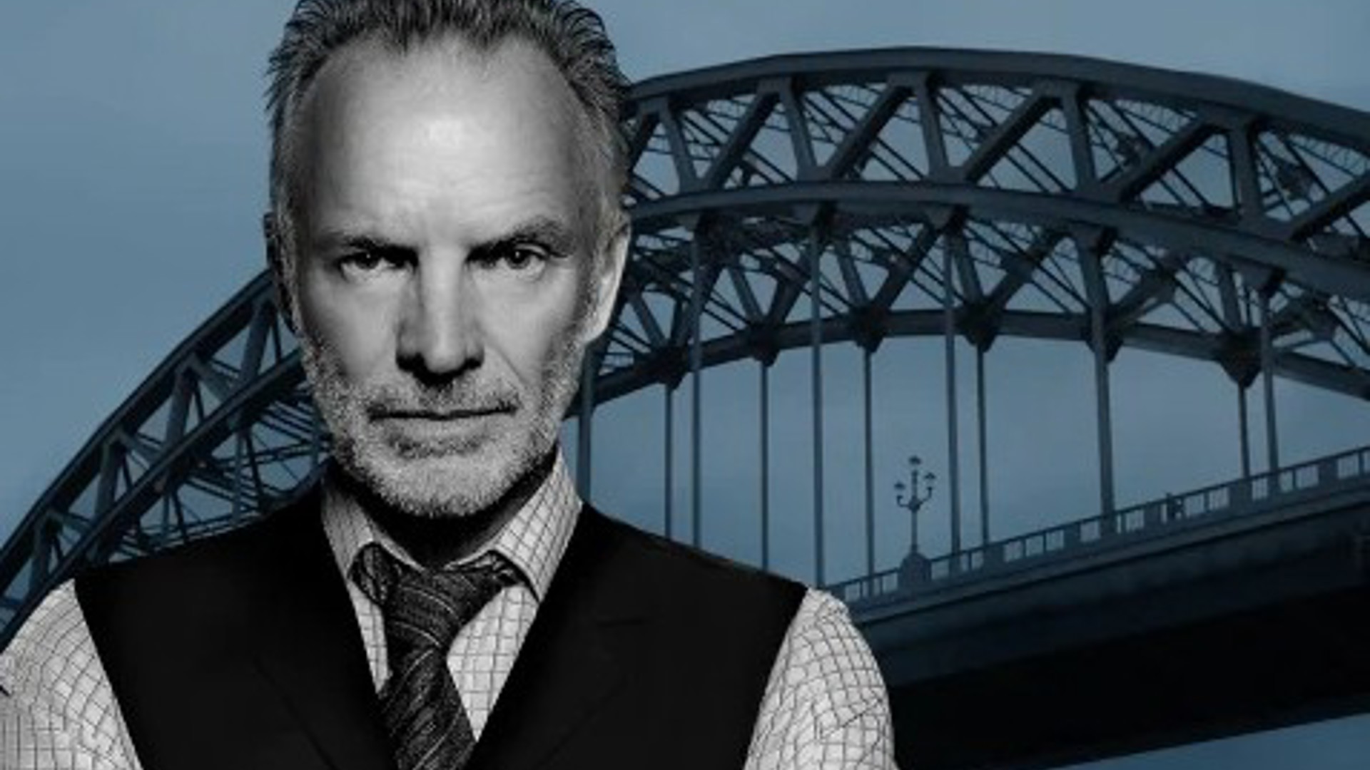 Singer writer Sting in front of a bridge
