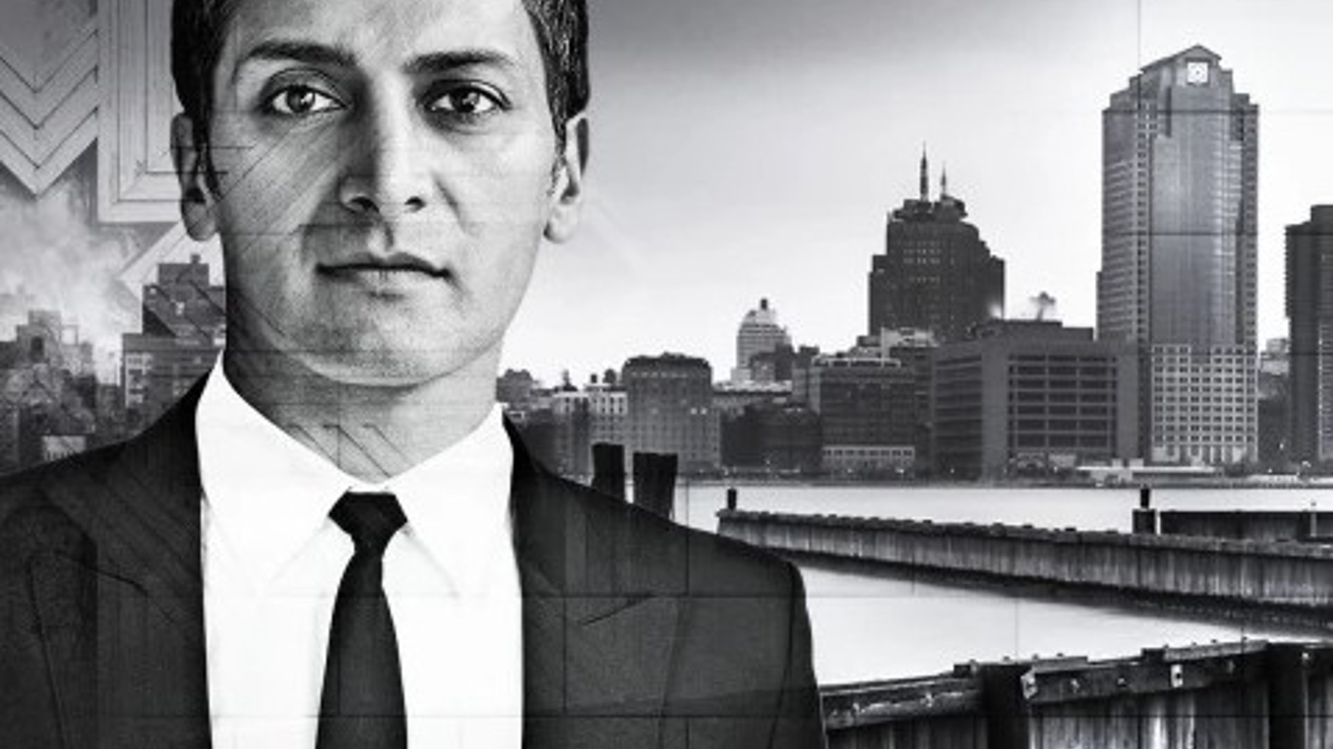 J Anthony Crane in front of a city with water for the dramatic play Disgraced