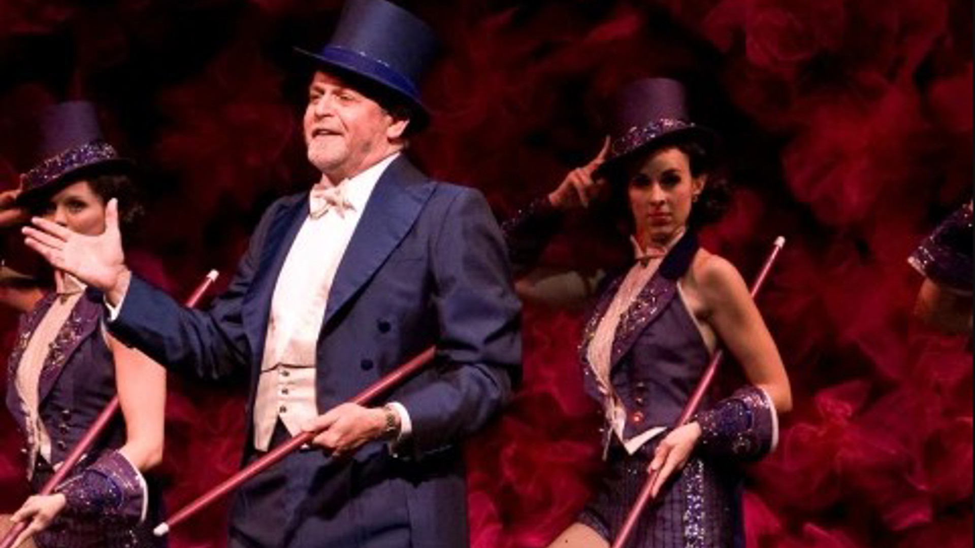 three people dancing in top hats and tails and canes in the play Follies