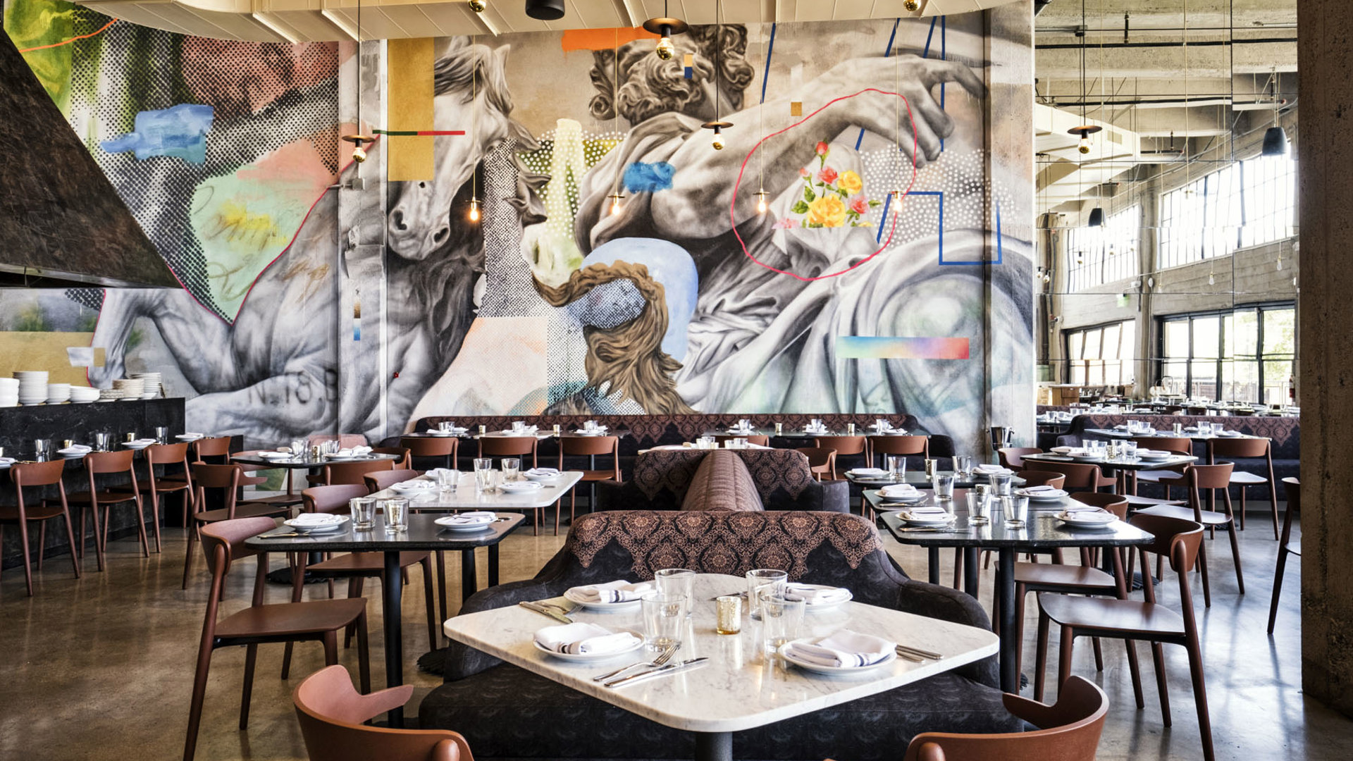 Rossoblu interior dining room with abstract art covering all walls. 