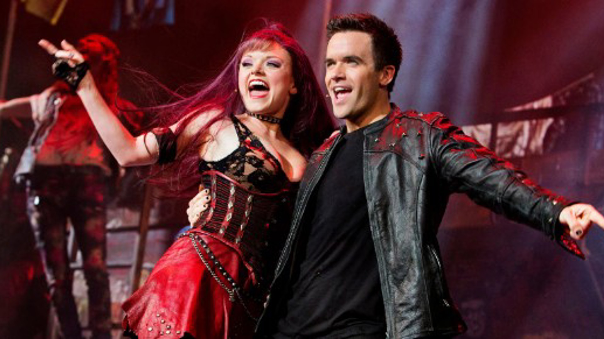 Brian Justin Crum and Ruby Lewis performance shot in the musical We Will Rock You